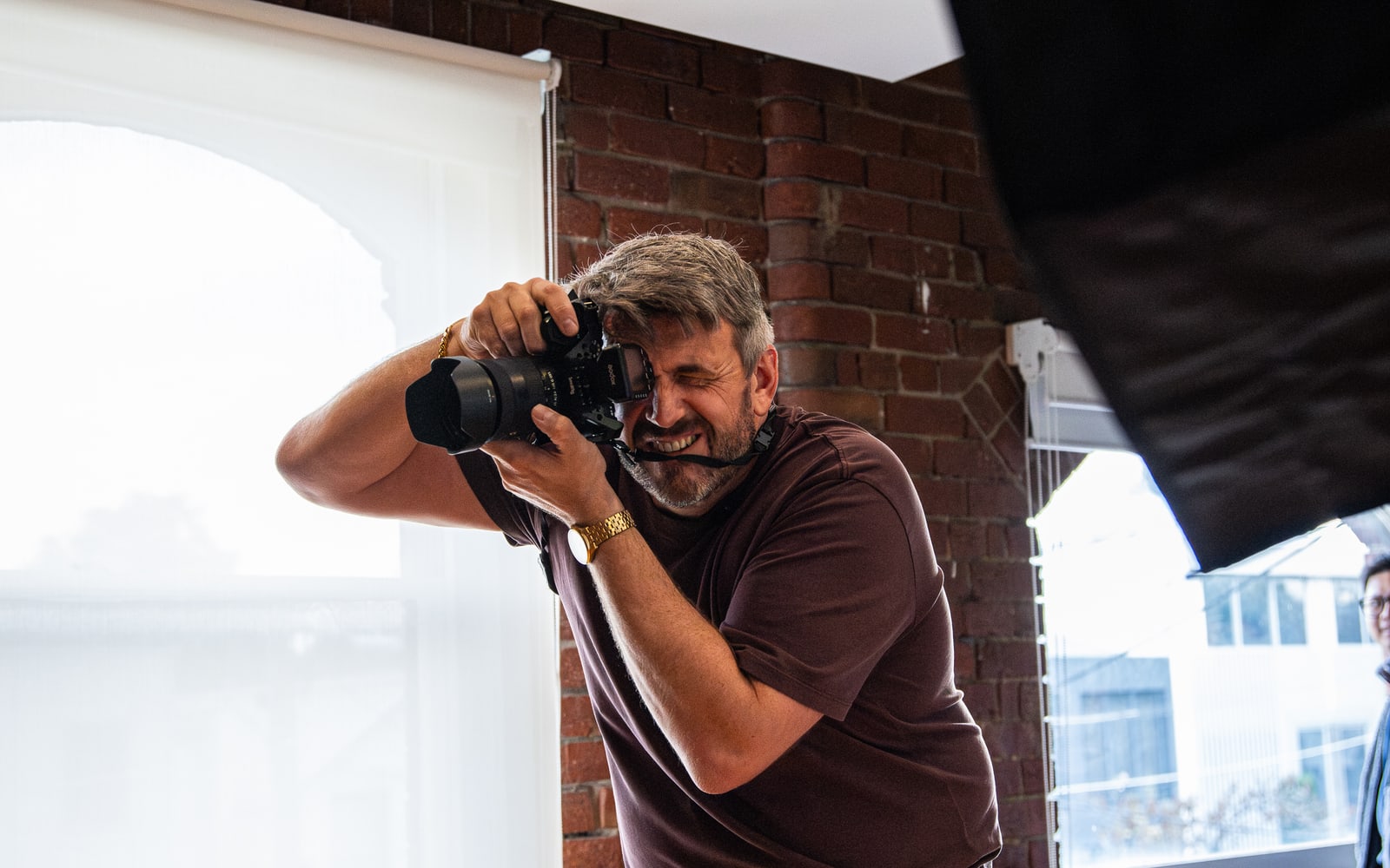 Kris Walters shooting on a mirrorless camera in a studio